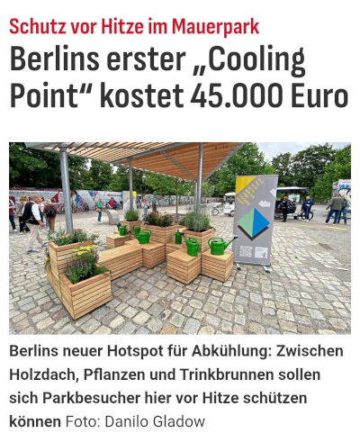 Eine Hitzeschutz-Oase in Berlin, mit Sonnenschirm und Blümchen